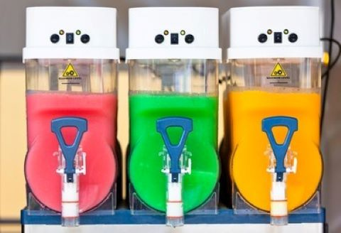 picture of a frozen drink machine with three flavors of Vino Slush wine slushies
